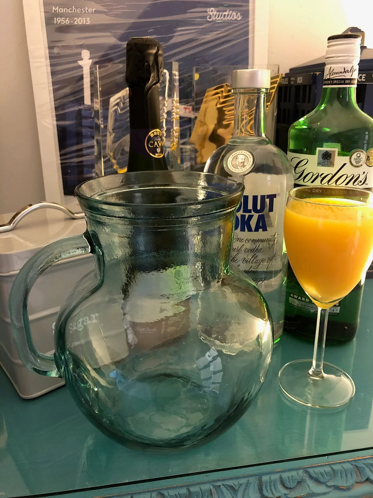 A glass of Agua de Valencia, the orange cava cocktail, on a bar table in Valencia
