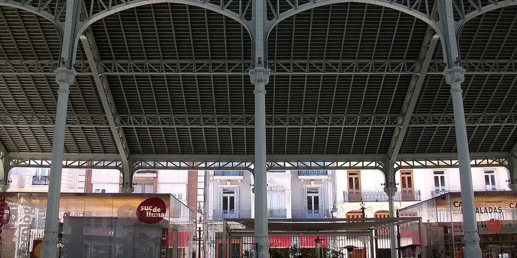 Inside the Mercado de Colón, under its iron roof
