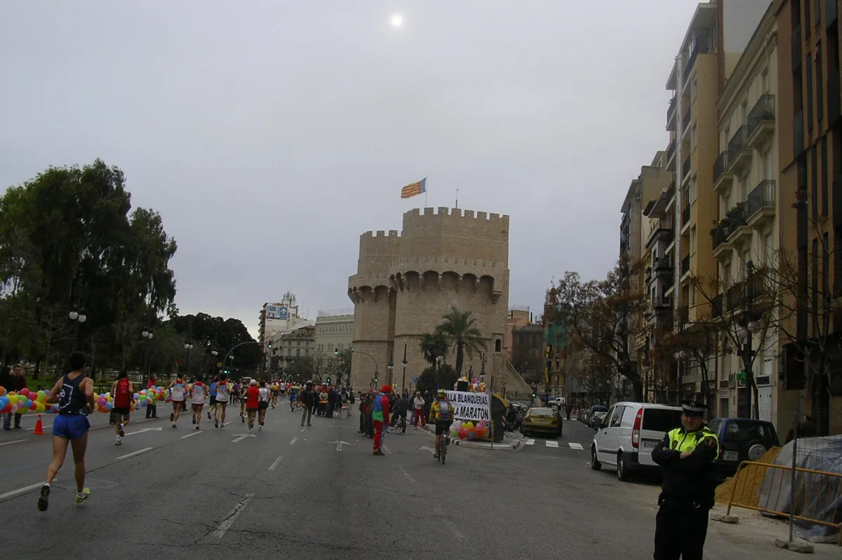 Marathon runners passing the Torres de Serranos gate in Valencia
