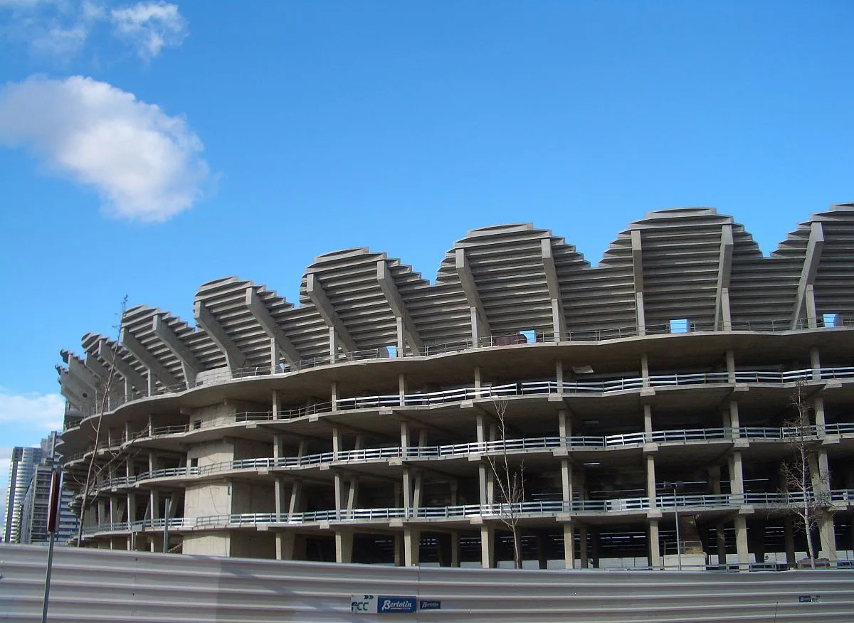 The unfinished concrete shell of Nou Mestalla, its scalloped upper tier open to the sky