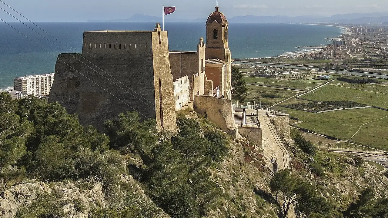 Cullera castle on its hilltop above the town, seen from the Jucar river