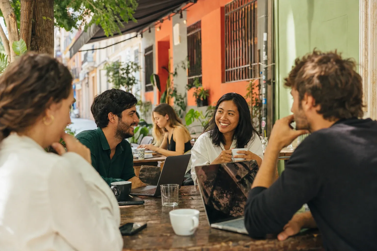 French expat professionals at a cafe terrace in Ruzafa, Valencia