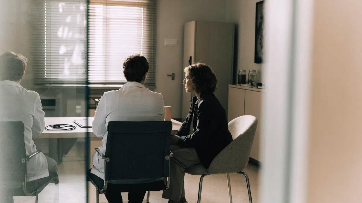 Doctor consulting with a patient in a Spanish clinic