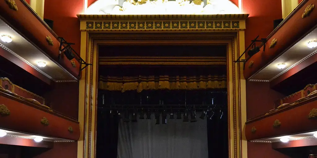 The stage and side boxes inside the Teatre Talia