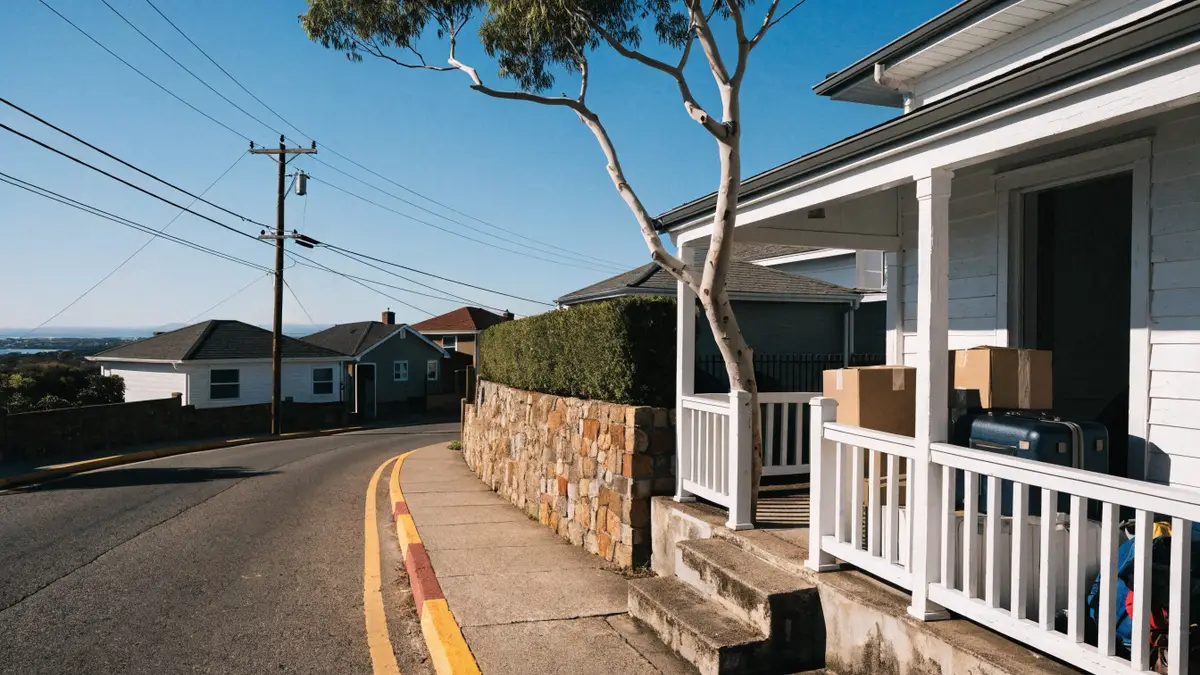 Suitcases and moving boxes on a sunny Australian porch