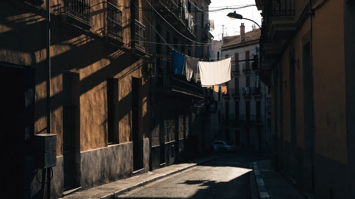 Sunlit narrow street in Valencia old town