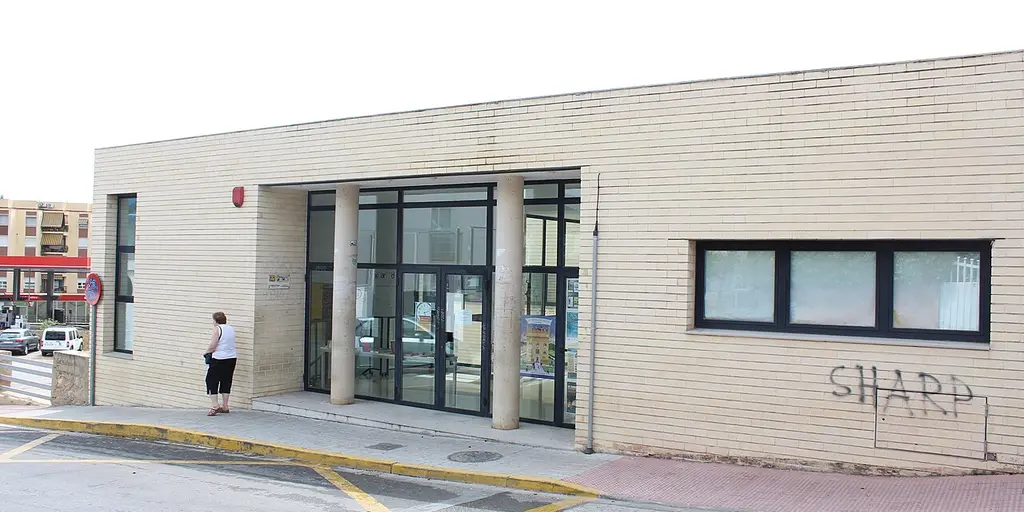 The municipal library building in Godella, a low pale brick block with a glazed entrance