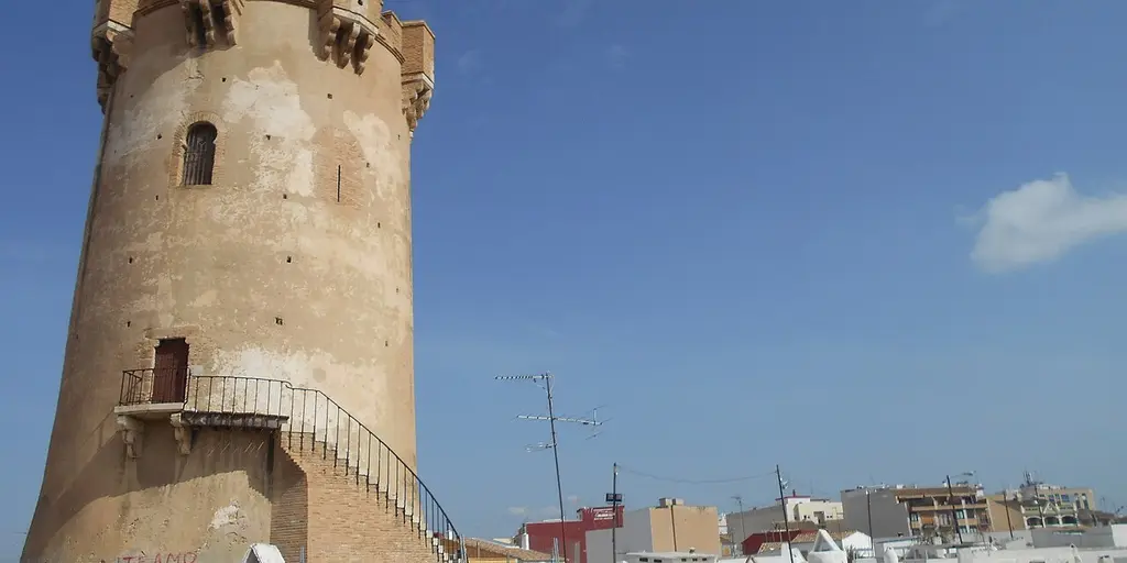 The medieval Torre de Paterna, a round stone tower with an outside staircase